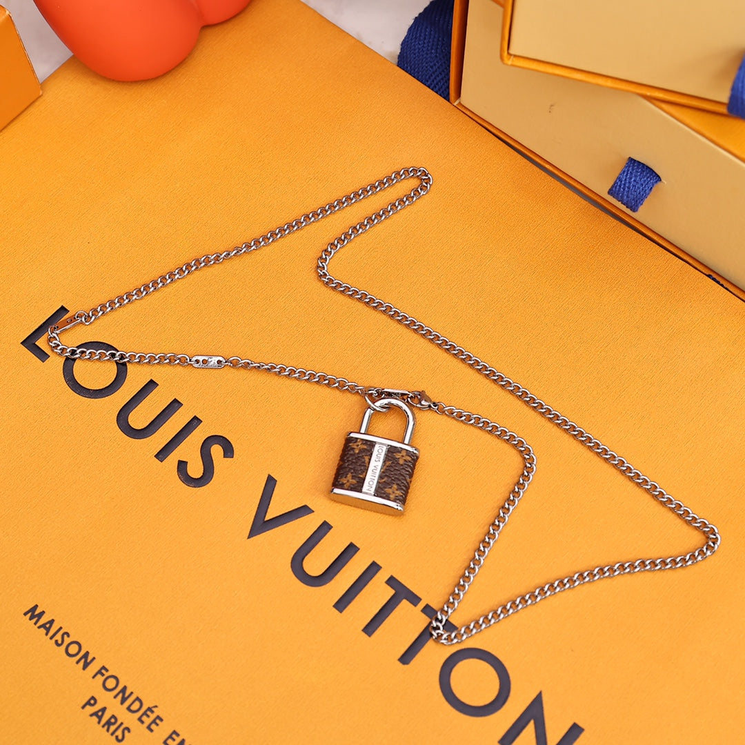 Louis Vuitton M00525 Monogram Lock Pendant | louis vuitton m00525 monogram lock pendant 3 louis vuitton m00525 monogram lock pendant 3