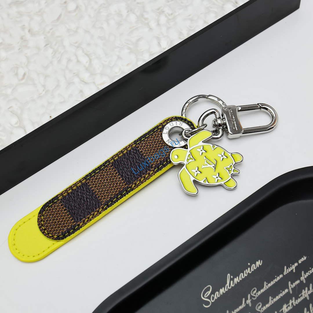Louis Vuitton M02558 Dragonne Tab Key Holder and Bag Charm yellow | louis vuitton m02558 dragonne tab key holder and bag charm yellow 3