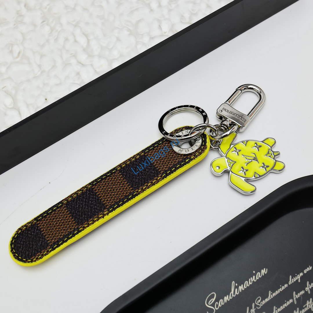 Louis Vuitton M02558 Dragonne Tab Key Holder and Bag Charm yellow | louis vuitton m02558 dragonne tab key holder and bag charm yellow 4